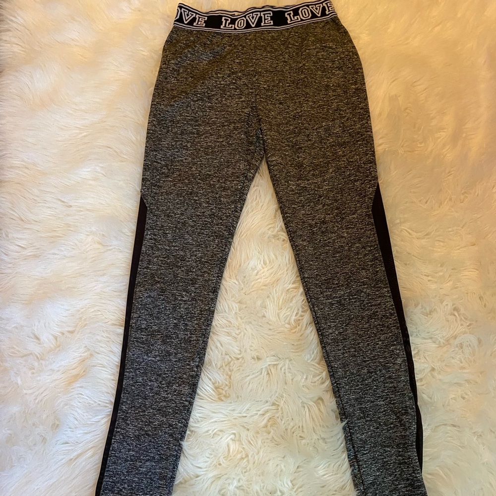 Athletic leggings, barely worn, with a fishnet material done the sides.